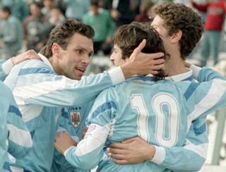 Enzo Francescoli is congratulated by Gustavo Poyet and Alvaro Gutierrez after scoring for Uruguay against Paraguay at the 1995 Copa America.