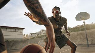 The Oakley Meta HSTN smart glasses being used by a basketball player