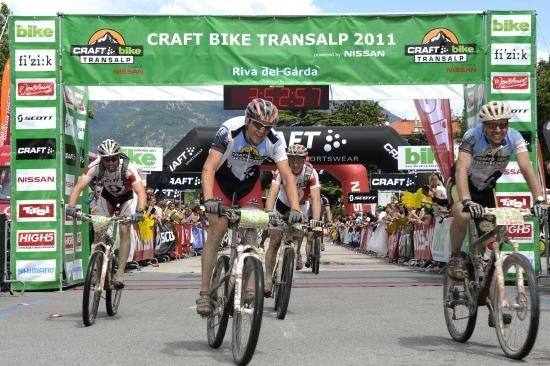 The blue jersey clad leaders cross the line for the win