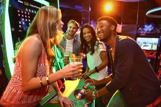 Group playing Galaga