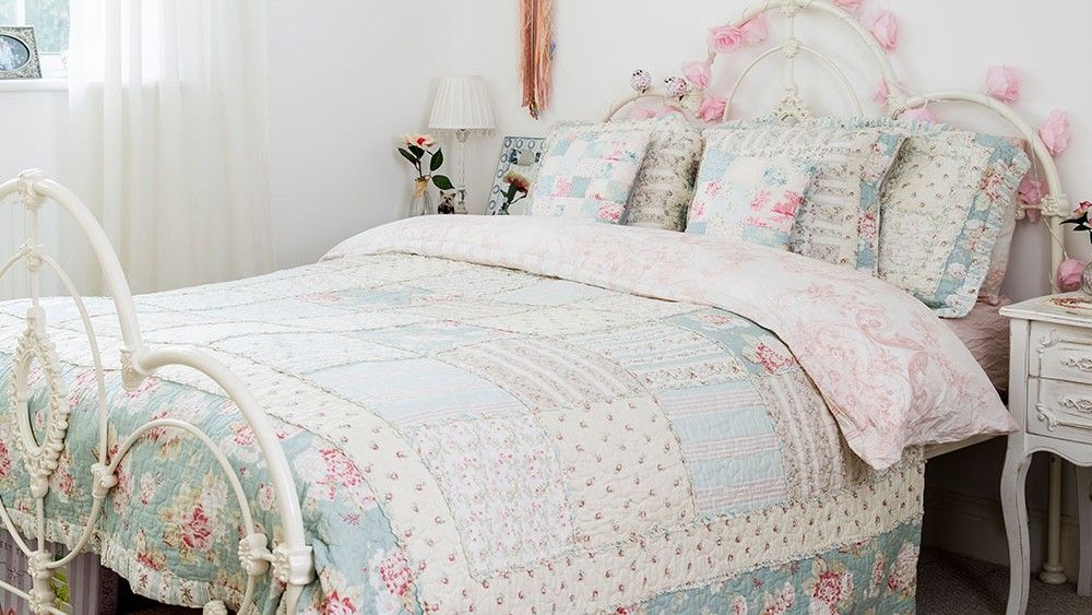 bedroom with pink wall and window with curtains