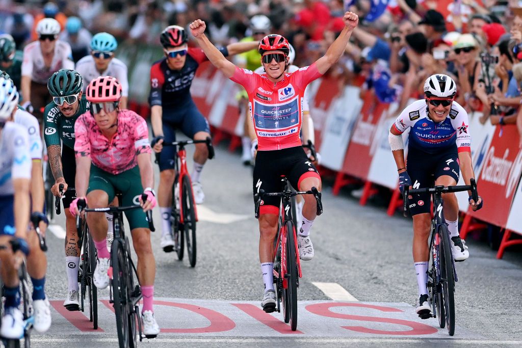 MADRID SPAIN SEPTEMBER 11 Remco Evenepoel of Belgium and Team QuickStep Alpha Vinyl Red Leader Jersey celebrates at finish line as final race winner during the 77th Tour of Spain 2022 Stage 21 a 967km stage from Las Rozas to Madrid LaVuelta22 WorldTour on September 11 2022 in Madrid Spain Photo by Justin SetterfieldGetty Images