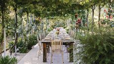 A dining table under a pergola