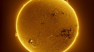 sun appears as a glowing yellow ball of plasma.