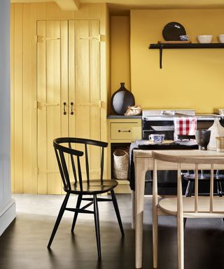 Yellow painted kitchen with traditional furnishings