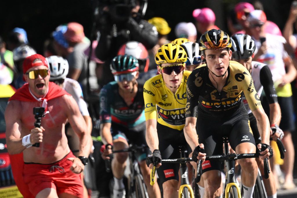 Jumbo-Visma's US rider Sepp Kuss cycles ahead of Jumbo-Visma's Danish rider Jonas Vingegaard wearing the overall leader's yellow jersey in the final ascent on the Col de Joux Plane during the 110th edition of the Tour de France cycling race, 152 km between Annemasse and Morzine Les Portes du Soleil, in the French Alps, on July 15, 2023. (Photo by Marco BERTORELLO / AFP)