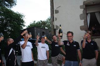 The riders raise a glass after their best ever day in the Tour de France