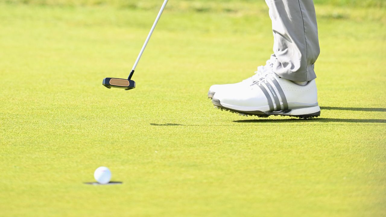 A PGA Tour player holing a putt