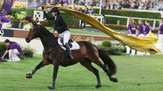 Lisa Rockener galloping around the Aachen arena