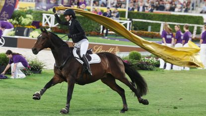 Lisa Rockener galloping around the Aachen arena