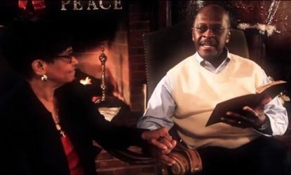 Herman Cain's new Christmas video features the former presidential hopeful reading from the Bible while holding hands with his wife, Gloria.