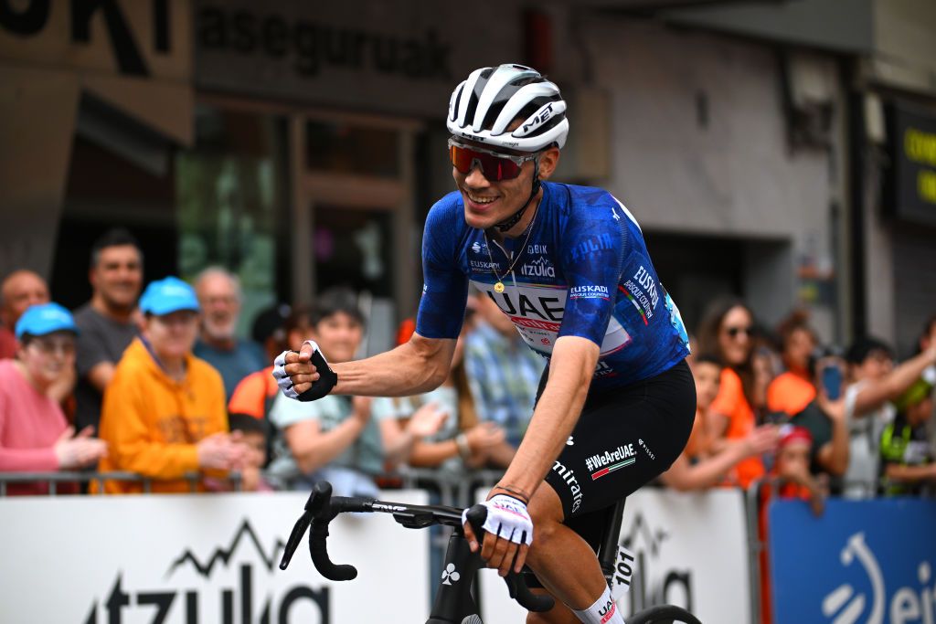 EIBAR SPAIN APRIL 06 Juan Ayuso of Spain and UAE Team Emirates Blue Best Young Rider Jersey celebrates at finish line as overall race winner during the 63rd Itzulia Basque Country 2024 Stage 6 a 1378km stage from Eibar to Eibar UCIWT on April 06 2024 in Eibar Spain Photo by Tim de WaeleGetty Images