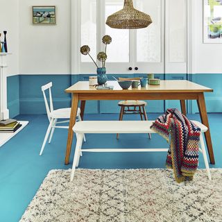 geometric mint rug with wooden table
