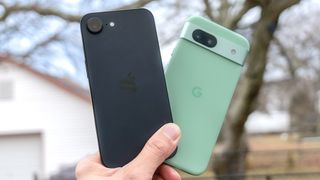 iPhone 16e vs Pixel 8a held in the hand.