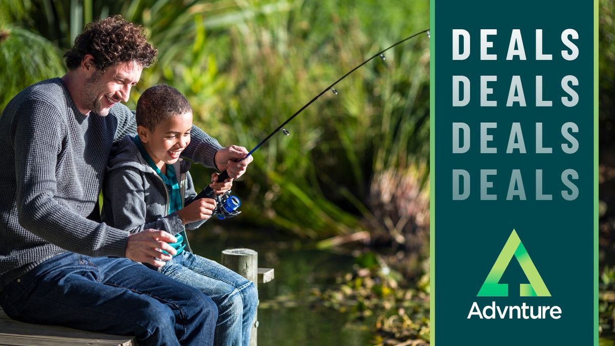 Father and son fishing from boardwalk