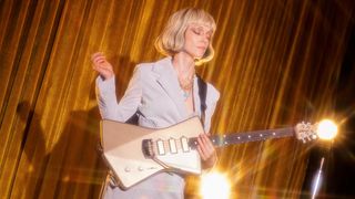 St. Vincent with her new Ernie Ball Music Man signature Goldie guitar