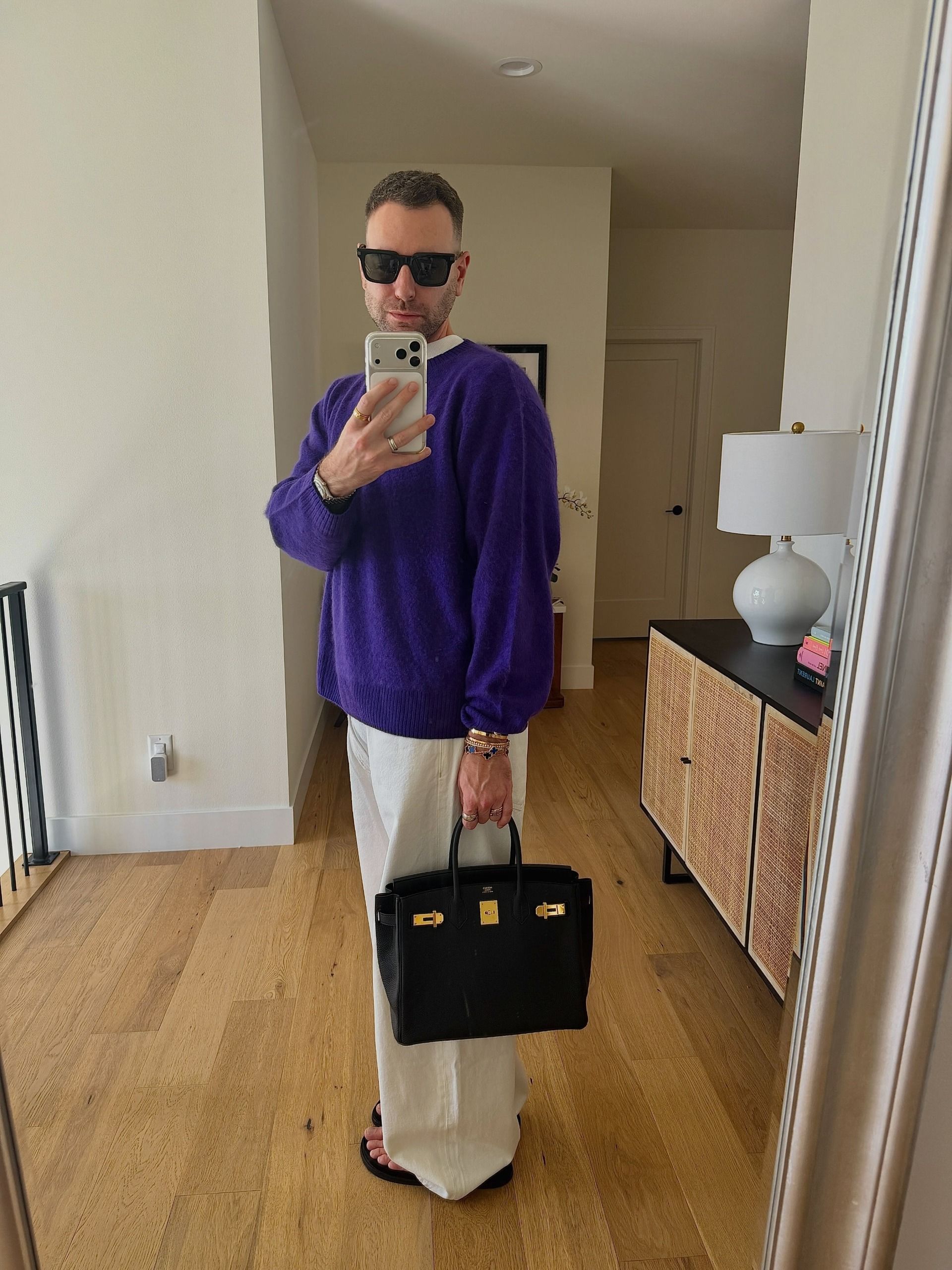 Who What Wear editor wearing a royal purple sweater, a big fall 2026 micro-trend.