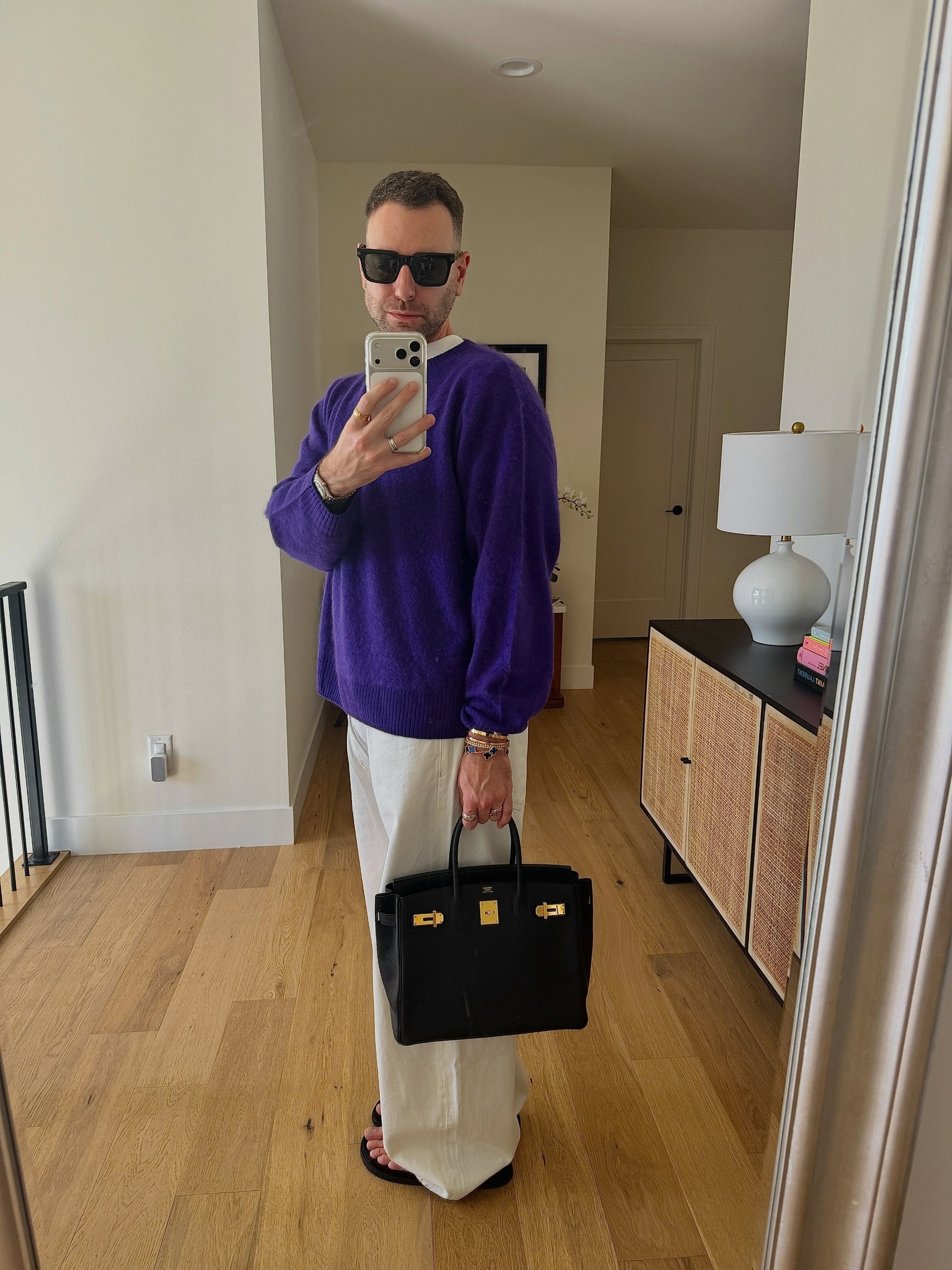 Who What Wear editor wearing a royal purple sweater, a big fall 2026 micro-trend.