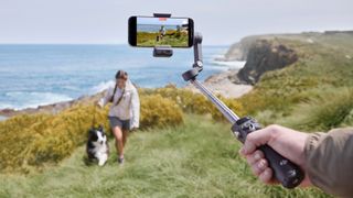 DJI Osmo Mobile 7P and person with dog