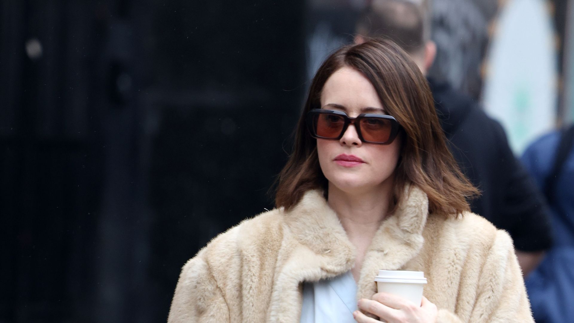 CLAIRE FOY WEARS A FAUX FUR JACKET