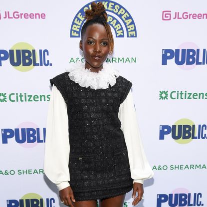 Lupita Nyong'o attended a Shakespeare in the Park event in a ruffled white-and-black dress