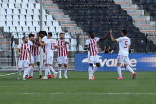 Olympiacos players celebrate a goal, later ruled out by VAR, in a game against PAOK as the Greek Super League returns after an enforced break due to Covid-19 in June 2020.