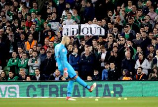 Tennis balls are thrown onto the pitch at the Aviva Stadium in Dublin