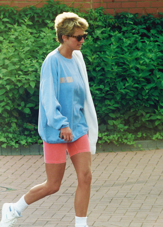 Diana, Princess of Wales, wearing a pale blue sweatshirt, pink cycling shorts and sunglasses, leaves Chelsea Harbour Club on August 24, 1994 in London, United Kingdom