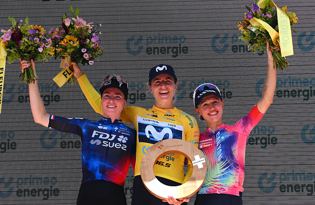 KUSNACHT, SWITZERLAND - JUNE 15: (L-R) Demi Vollering of Netherlands and Team FDJ - SUEZ on second place, race winner Marlen Reusser of Switzerland and Team Movistar - Yellow Leader Jersey and Katarzyna Niewiadoma of Poland and Team CANYON/SRAM zondacrypto on third place pose on the podium ceremony after the 5th Tour de Suisse Women 2025, Stage 4 a 129.4km at stage from Kusnacht to Kusnacht / #UCIWWT / on June 15, 2025 in Kusnacht, Switzerland. (Photo by Tim de Waele/Getty Images)