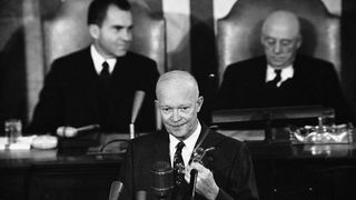 President Eisenhower addressing a joint session of Congress in 1958. Behind the president are Vice President Richard Nixon, left, and Speaker of the House Sam Rayburn, right.