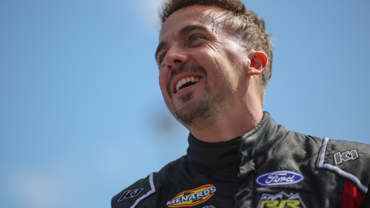 Frankie Muniz, driver of the #30 Hair Club Ford, walks the grid prior to the ARCA Menards Series BRANDT 200 Supporting Florida FFA at Daytona International Speedway on February 18, 2023 in Daytona Beach, Florida