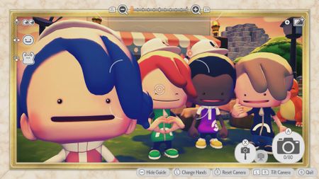 In Pokemon Pokopia, four Ditto human players pose for a selfie photo using the in-game Pokedex in multiplayer