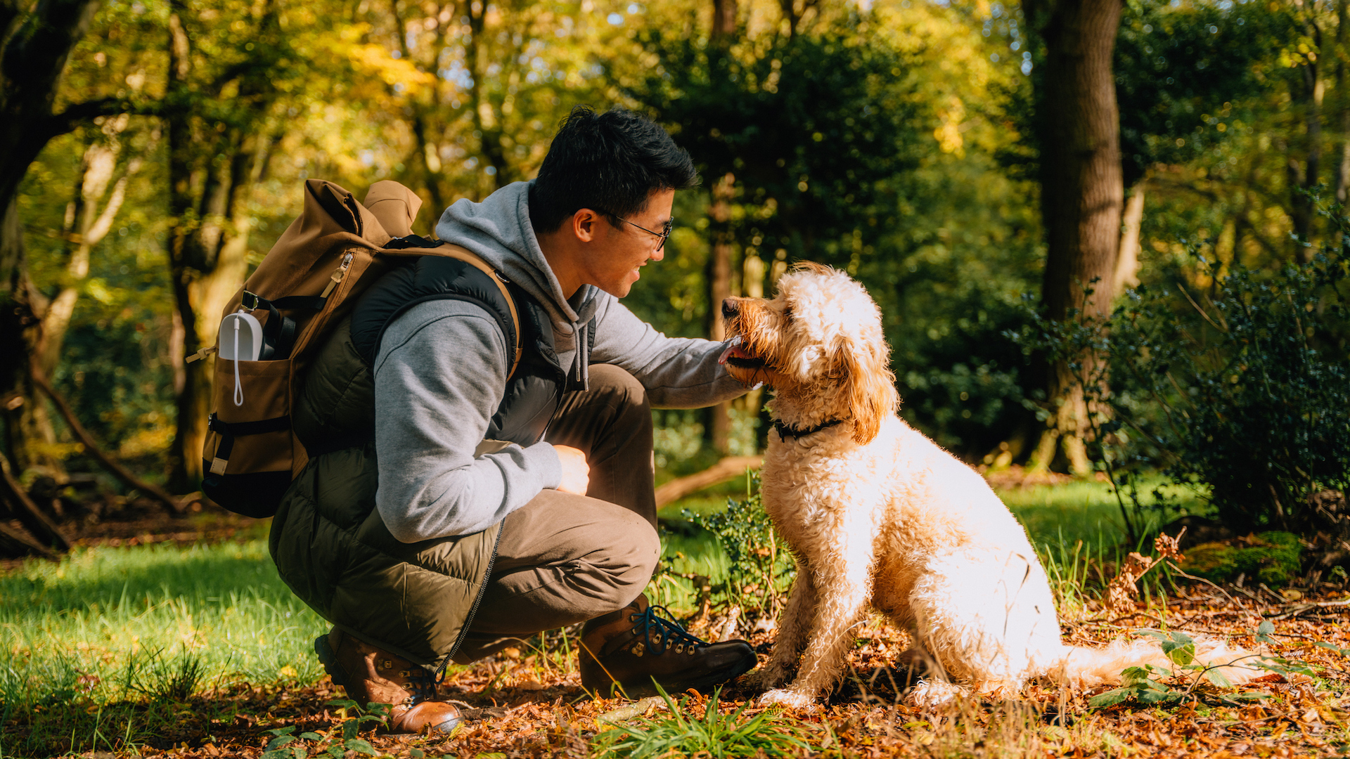 Man with his dog looking happy