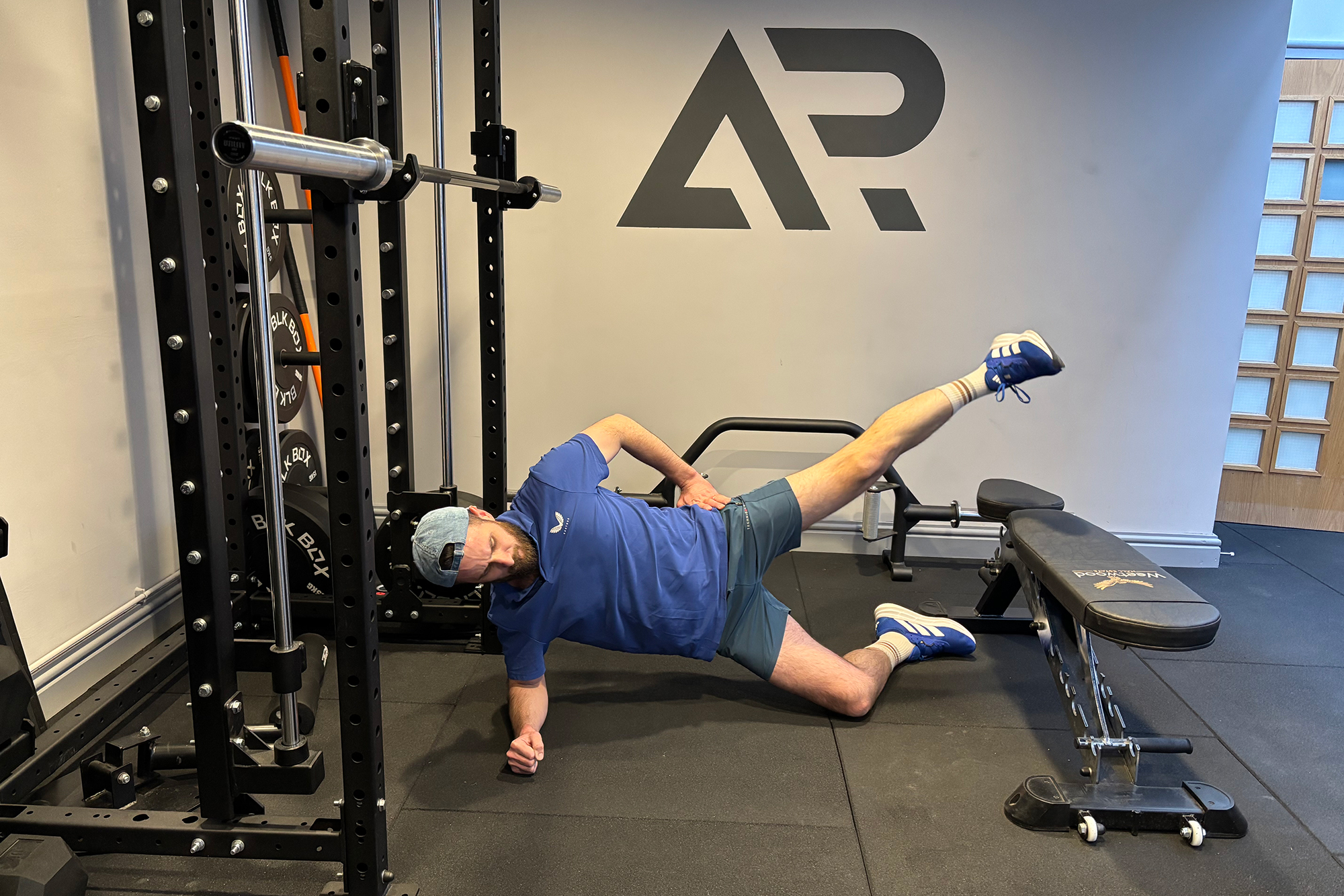 Baz Plummer demonstrating a side plank leg lift