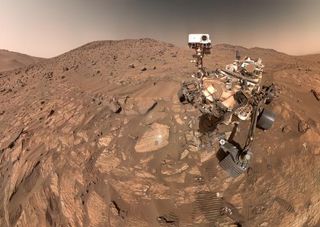 The Perseverance rover is seen on Mars in a fish-eye lens selfie.