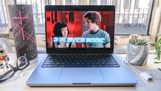 The MacBook Pro 2021 (14-inch) with Scott Pilgrim vs The World playing on it