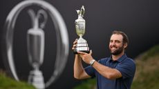Scottie Scheffler hoists the Claret Jug at Royal Portrush after winning The Open in 2025