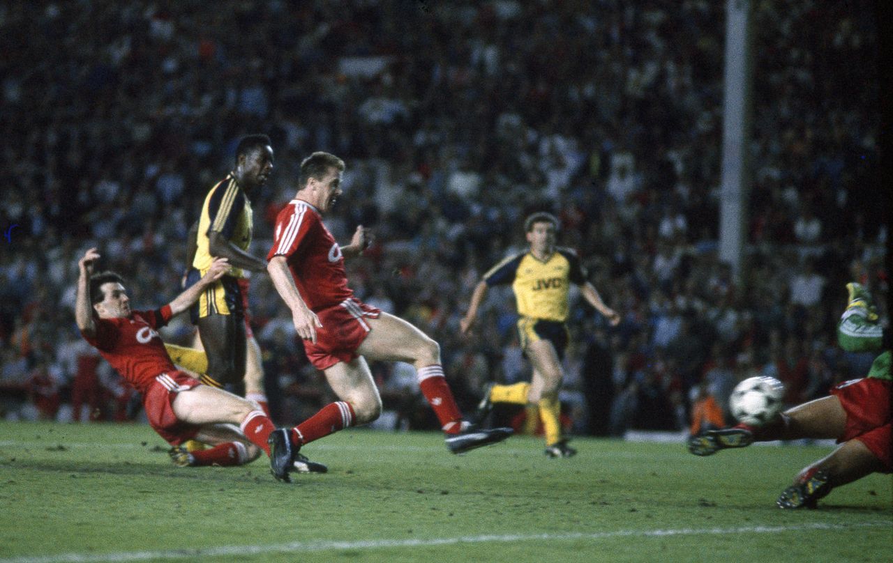 Michael Thomas of Arsenal scores the decisive, title-winning goal against Liverpool in the First Division match at Anfield, May 1989