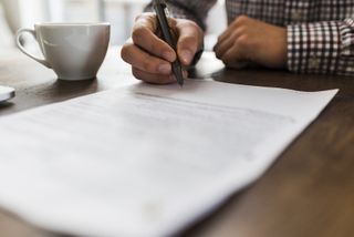 a person signing a contract