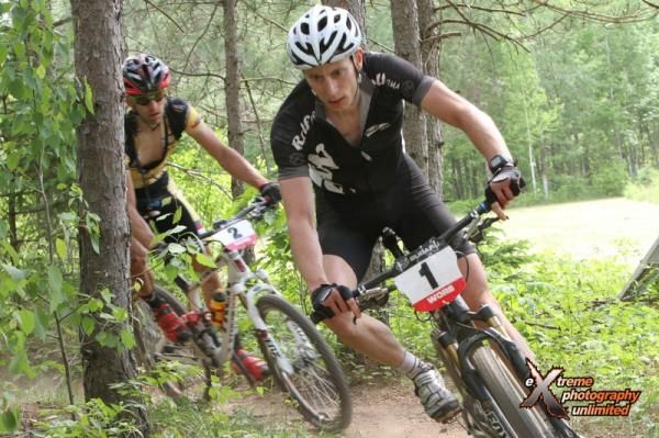 Tristan Schouten (Rolf Prima / Giant) leads Brian Matter (Gear Grinder / Trek) through a sandy singletrack section in Nine Mile Forest outside Wausau, WI.