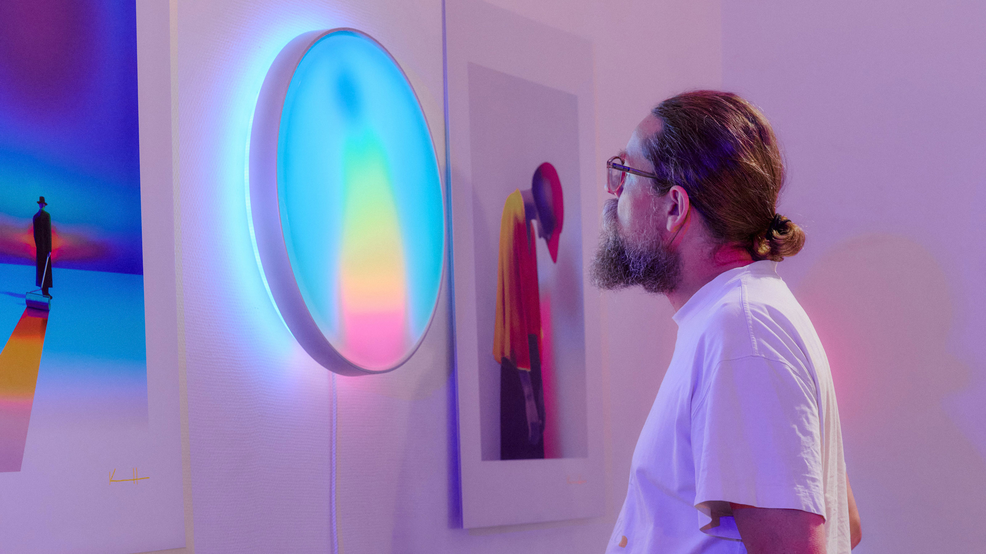 Man looking at light with coloured display