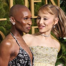 British actress, singer Cynthia Erivo (L) and US singer-songwriter Ariana Grande (R) arrive for the 82nd annual Golden Globe Awards at the Beverly Hilton hotel in Beverly Hills, California, on January 5, 2025.