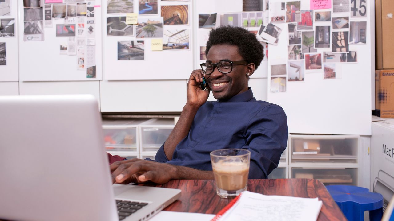 Man sitting down at his desk