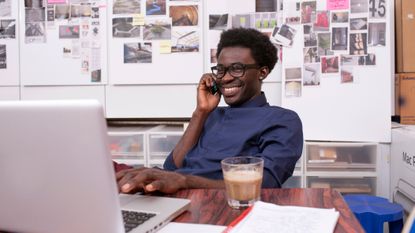 Man sitting down at his desk