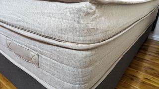 A handle on one end of the Eva Premium Adapt Mattress