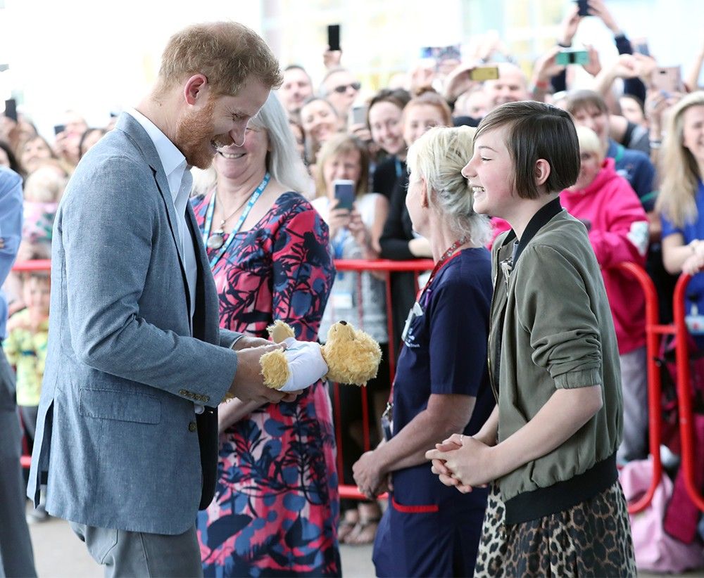 Daisy Wingrove, a 13-year-old former cancer patient, gifts Prince Harry a teddy bear for Archie in May at the Oxford Children’s Hospital.