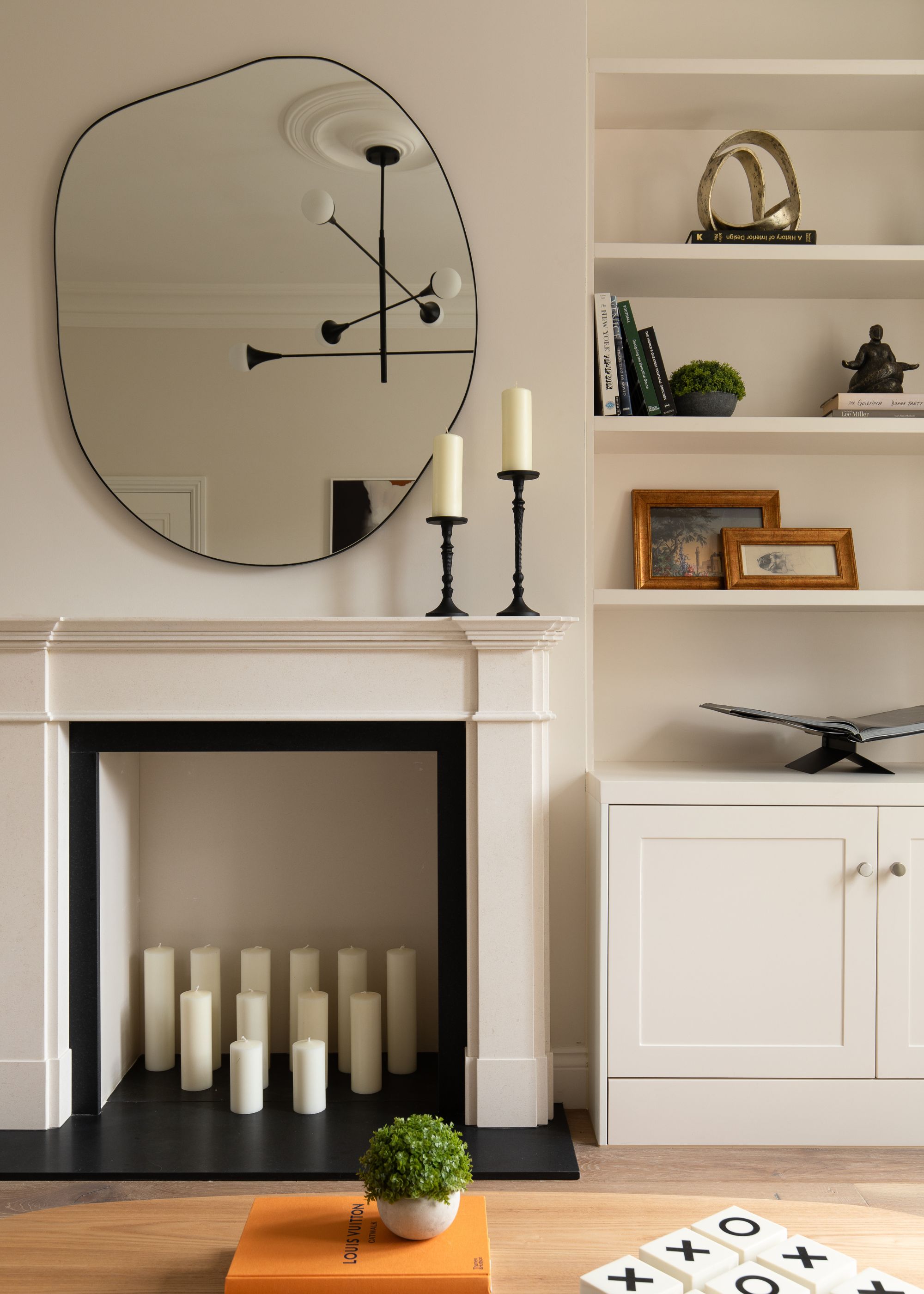 modern living room with sculptural wall mirror