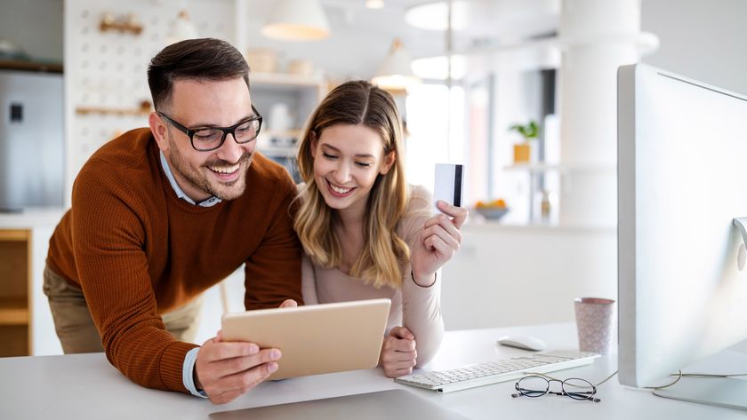 Young couple online shopping on iPad