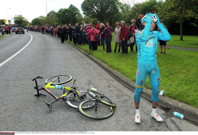 Borut Bozic (Astana) holds his head wondering where those other two wheels came from