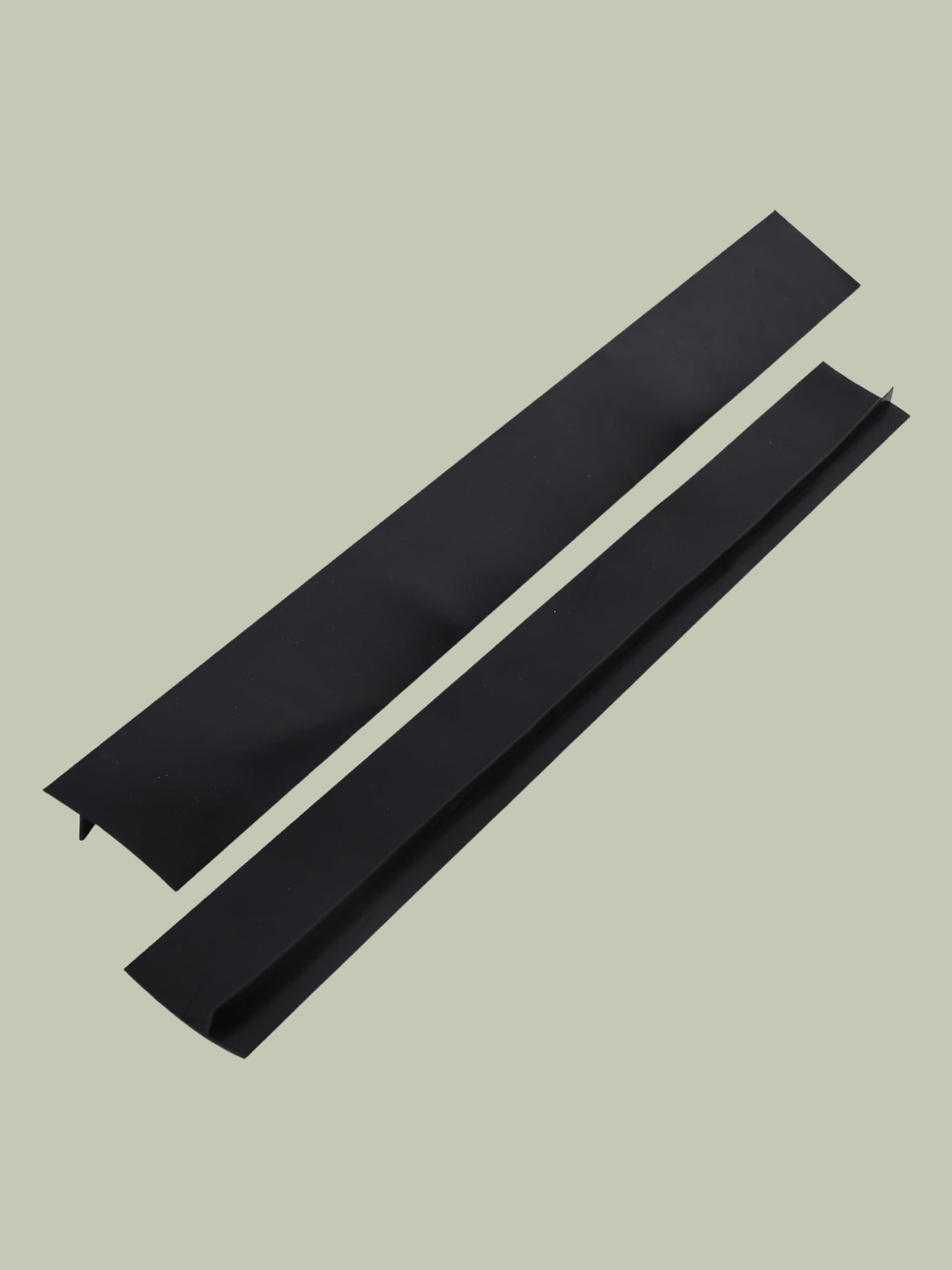 A pair of black stove gap covers from Amazon